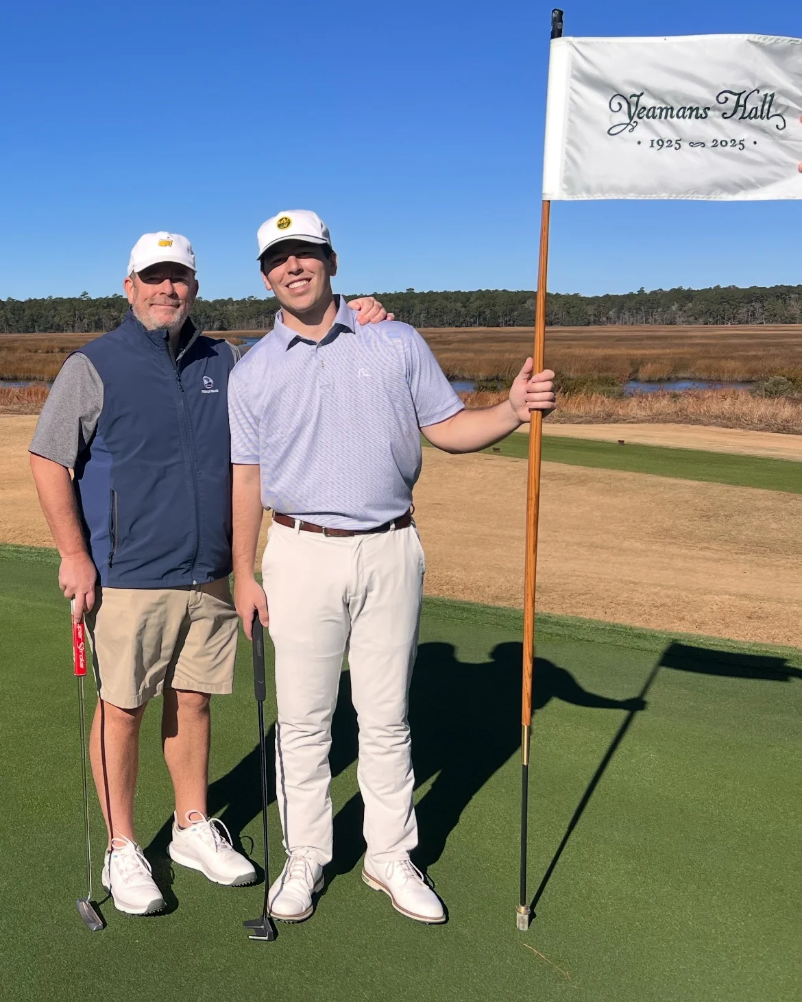 Dr. Chad Norris and his son Sam Norris on a golf course in the Lowcountry