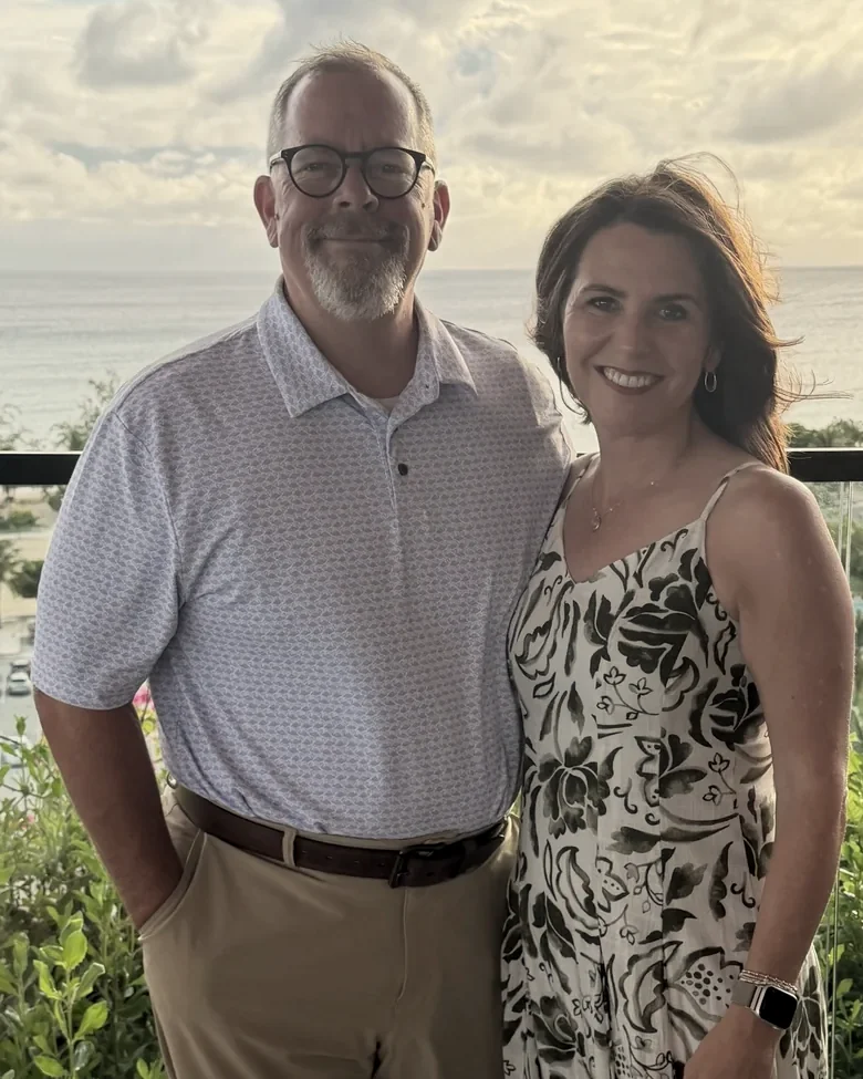 Dr. Chad Norris and Wendy Norris standing together outdoors at golden hour
